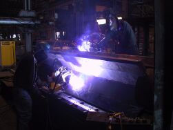 Programmed welding SAW and FCAW as well as manual SMAW, FCAW, and GTAW are performed at Trans Bay Steel.